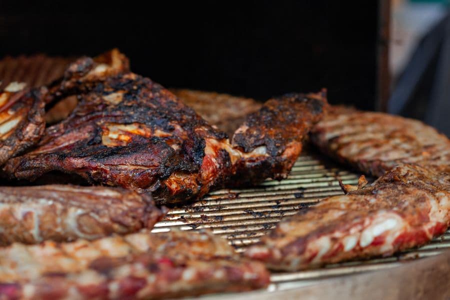 Seasoned meat charring on a barbecue
