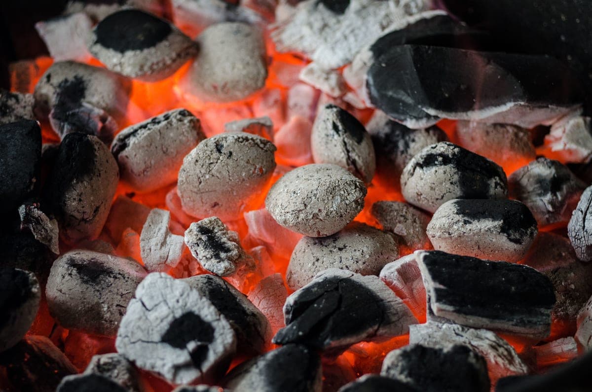 Glowing charcoal coals in a grill